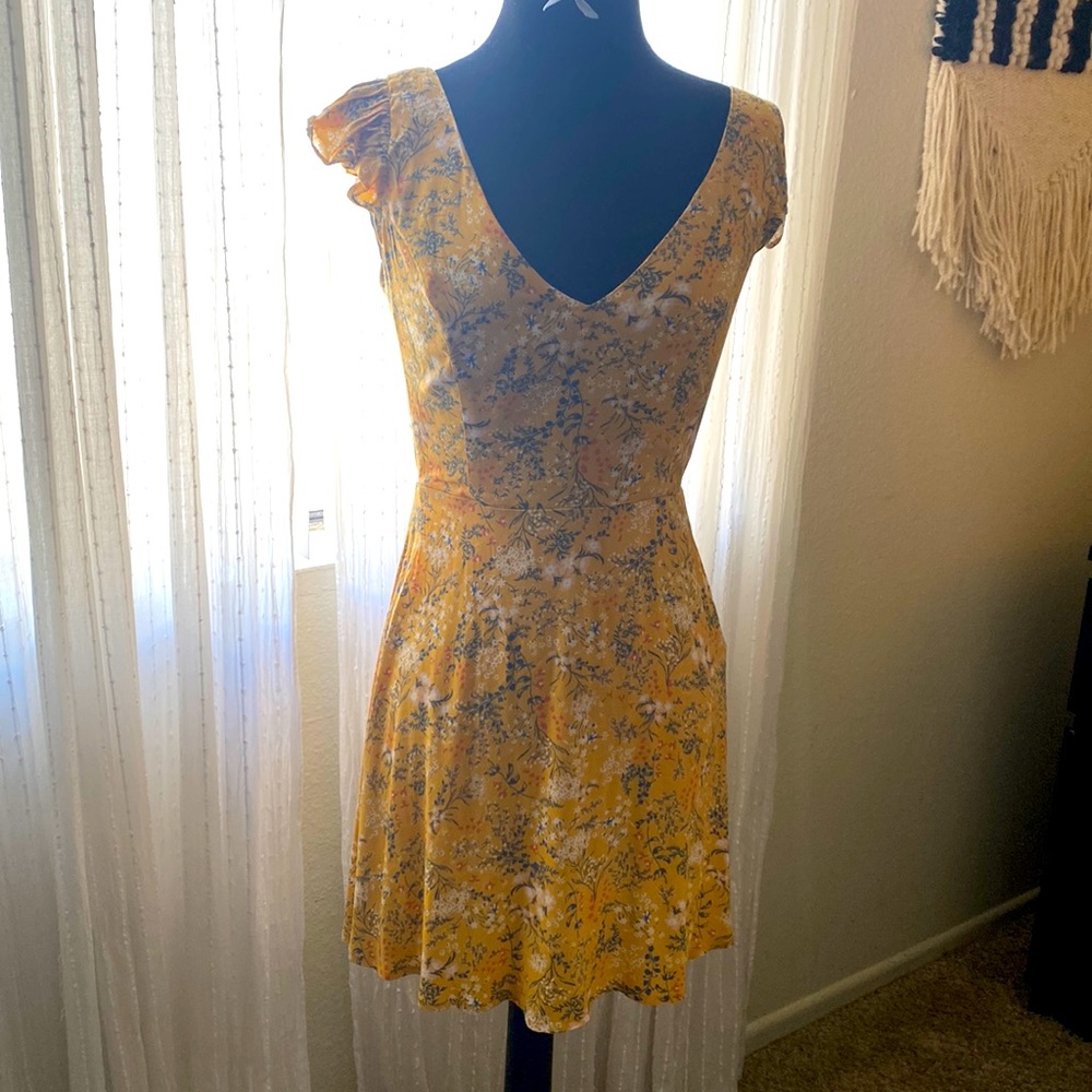 Floral print skater dress. Super cute open back flutter sleeve sundress.